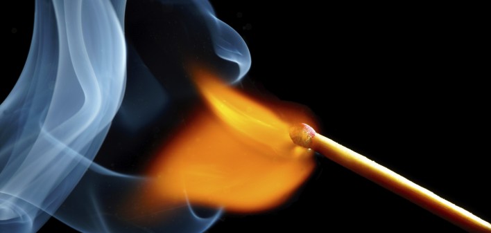 igniting match and smoke