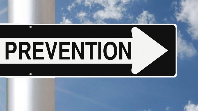 Ounce of Prevention sign against a blue sky